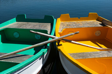 green and yellow boats on the water