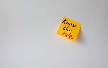 Know the rules symbol. Concept words Know the rules om orange steaky note. Beautiful white background. Business and Know the rules concept. Copy space.
