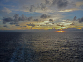 Breathtaking sunrise sunset twilight blue hour dusk dawn cloud horizon nature landscape scenery at sea seen from cruiseship cruise ship liner panorama during cruising