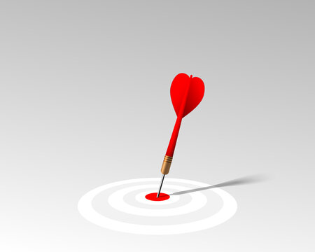 Red dart hit to center of white dartboard on the gray floor. Arrow on bullseye in target. Business success, investment goal, marketing challenge, financial strategy, purpose achievement, ideas concept