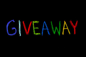 colored text the giveaway drawn on blackboard