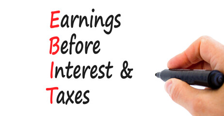 EBIT symbol. Concept words EBIT earnings before interest and taxes on white paper on beautiful white background. Businessman hand. Business EBIT earnings before interest and taxes concept. Copy space.