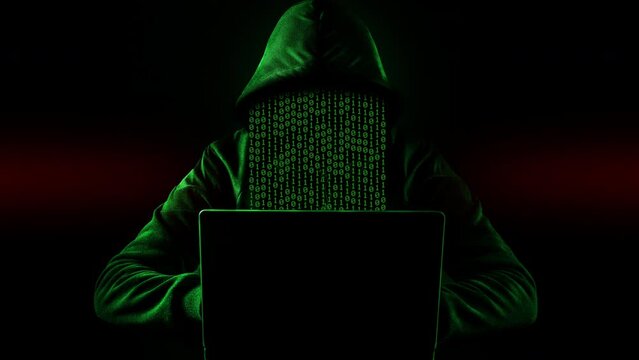 Hacking and technology crime concept. No face hacker with laptop with abstract programming code elements.