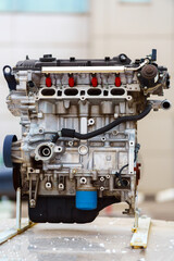 Disassembled internal combustion engine stands on a training stand