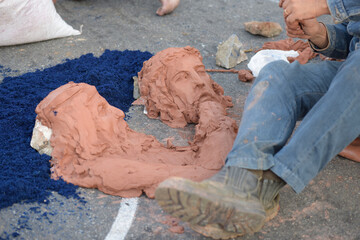 Sculpture in clay, in the street carpet at the celebration of Corpus Christi in the city of Santana...