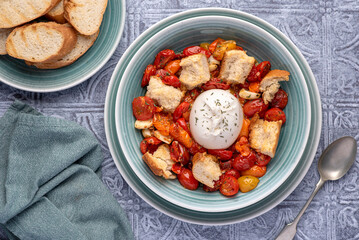 Food photography of baked tomatoes, cheese, burrata, mozzarella, garlic, crouton, thyme, toast