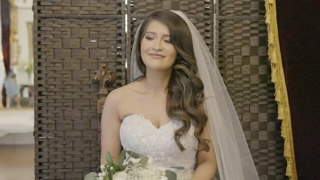 Young bride smiles as she is being photographed on wedding day. Shot in 4K 60 FPS. To purchase entire event raw at wholesale price email willneatheryyahoo.com.