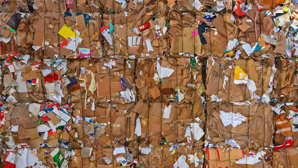 stacked waste paper and and cardboard collected for recycling