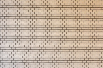 a beige ceramic tiled wall texture