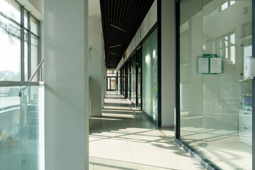 A corridor in an urban-type office building. Modern interior of the lobby of an office building...