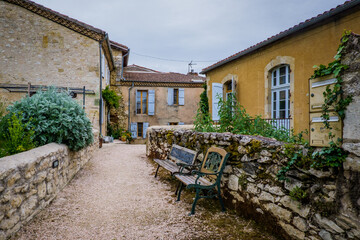 Fototapeta na wymiar Flowery street of the small village of Lavardens in the south of France (Gers)