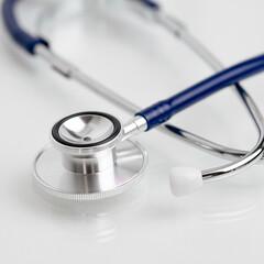 Stethoscope closeup on white background, medical instrument