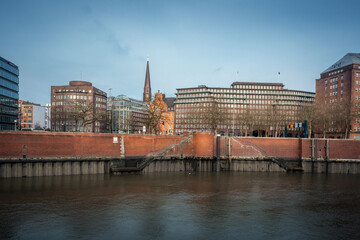 Fototapeta premium Hamburg Skyline from Speicherstadt warehouse district with Chilehaus and St. James Church - Hamburg, Germany