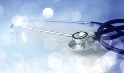 Medical stethoscope on bright abstract background