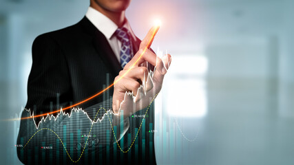 Businessman analyst working with digital finance business data graph showing technology of investment strategy for perceptive financial business decision. Digital economic analysis technology concept.