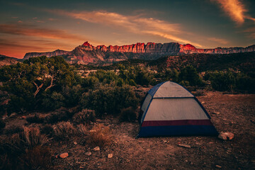 tent at sunset with moutains 