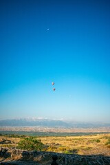 Fototapeta na wymiar two balloons in blue hierapolis sky turkey