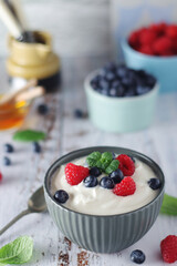 A bowl with Greek yogurt with berries