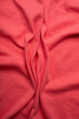 Pink soft fabric shaped as female genital organs, vulva and labia, vagina concept