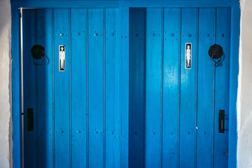 Blue bathroom door in a tavern in Cyprus