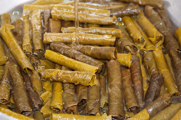 Preparation of Dolma, Sarma from grape leaves. It will be cooked with olive oil.