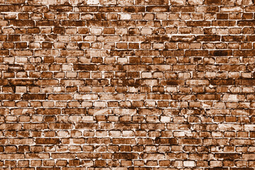 Brown brick wall. Horizontal decorative uneven blocks background. Urban architecture texture. Solid stone texture. Grunge brickwork structure.