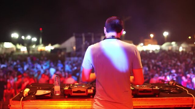 Dj playing to festival crowd