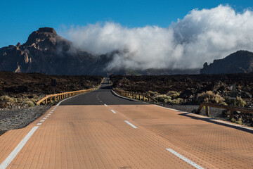 Road in clouds at El Teide National Park impression Tenerife Canary Islands, Spain