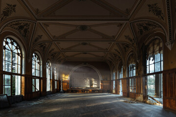 Large hall of abandoned building in gothic style