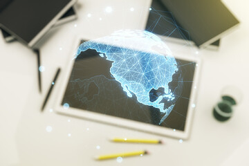 Double exposure of graphic America map and modern digital tablet on background, big data and digital technology concept