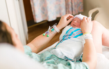 New Mother and Newborn in Hospital Room