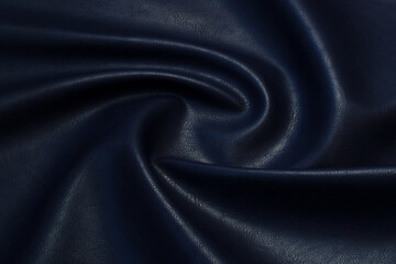 blue artificial leather with waves and folds on PVC base