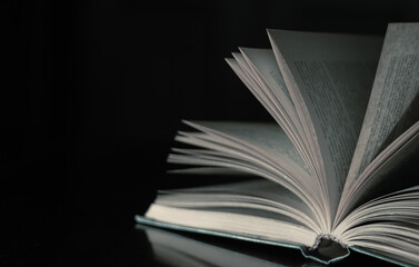 open book on black background