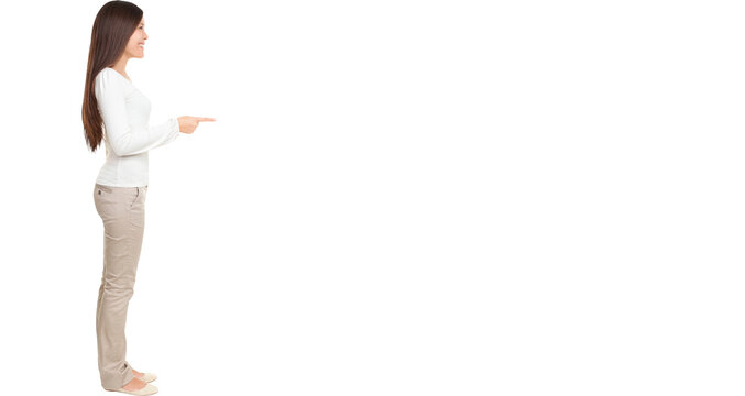 Full length side view of young woman pointing at copyspace isolated over white background
Isolated cut out in transparent PNG file