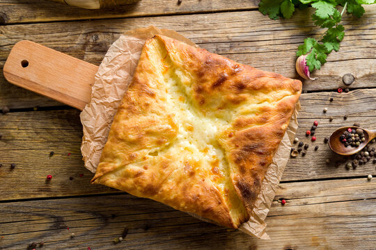 khachapuri layered with cheese georgian kitchen on old wooden table top view