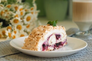 Meringue roll cake with cream, raspberries. Roulade, summer dessert. Confectionery, menu. Close up....