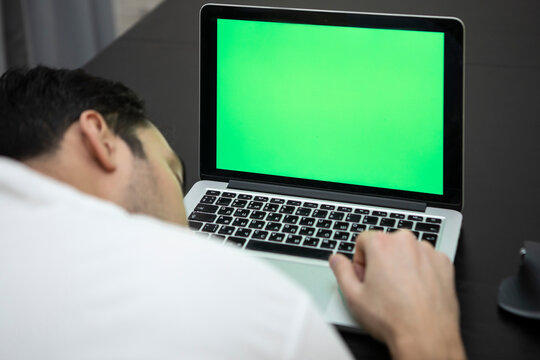 Man fell asleep while working on laptop. Green Screen concept