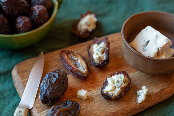 Date fruits stuffed with gorgonzola soft cheese