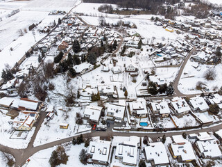 Obraz na płótnie Canvas Snow covered residential street, aerial drone view