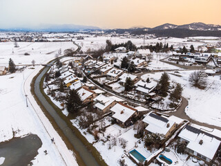 Snow covered residential street, aerial drone view