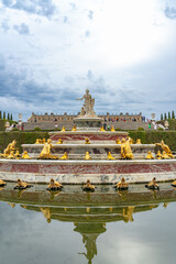 Palace Versailles with beautiful gardens and fountains from top. The Palace Versailles was a royal...
