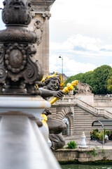 Pont Alexandre III bridge over river Seine. Bridge decorated with ornate Art Nouveau lamps and sculptures. The Alexander III Bridge across Seine river in Paris, France.