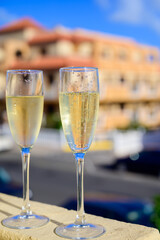 Dinner party, drinking of cava or champagne sparkling wine in vacation resort Caleta Fuste, Fuerteventura, Canary islands vacation, Spain