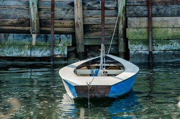 blue rowboat on the dock