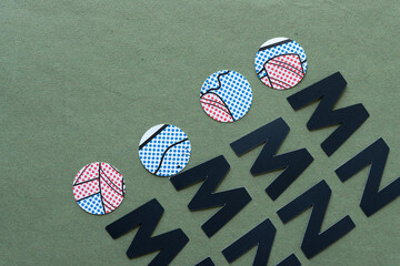 paper circles with abstract dots and letters m and n