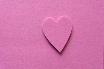 pile of pink felt hearts isolated on pink felt ground