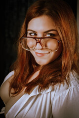 Fototapeta na wymiar Beautiful woman with glasses, librarian or businesswoman