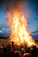 Fototapeta na wymiar lighting a human-shaped bonfire in Mohács during the busójárás