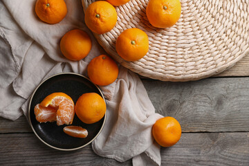 Many fresh ripe tangerines on wooden table, flat lay