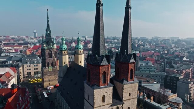 Drone shot revealing Marktkirche Unser Lieben Frauen (Market Church Of Our Lady), Halle (Saale) city , Saxony-Anhalt  , Germany .